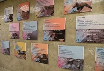 Posters describing the graduate students' work were posted in the hallway of the Capitol Building.