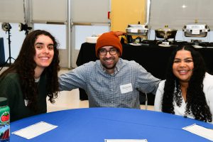 Group of three students seating together